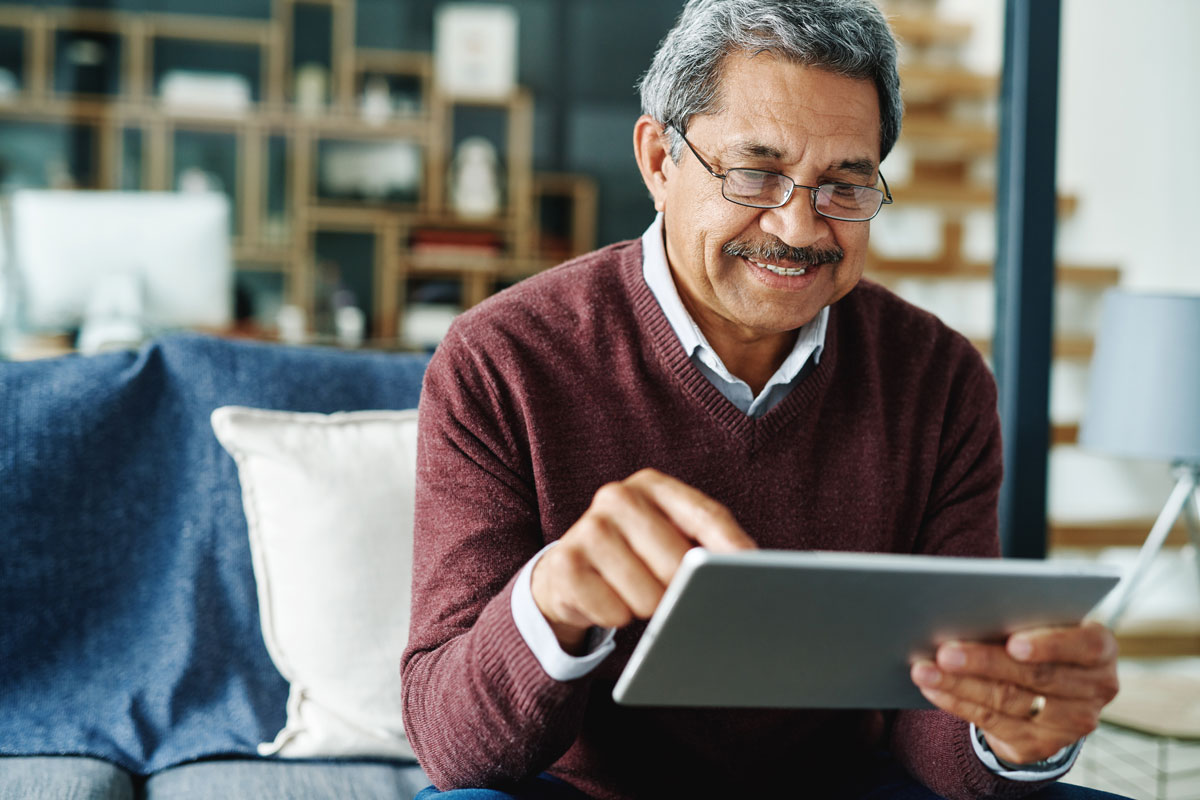 Senior man using a tablet